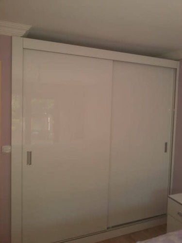 Large fitted wardrobe unit, designed in partnership with Ugur Bolat and client to accommodate large shelving space