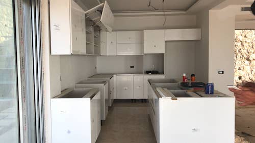 Mid project of high quality, bespoke kitchen for sea view villa (property value in excess of £500k). Kitchen by Mopa in  'Lotus' design, awaiting work top