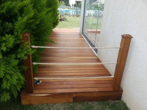 Garden decking made from Iroko wood, finished with teak oil. Designed and made by Ugur Bolat