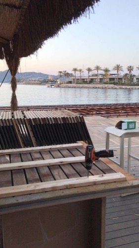 Creating and installing new beach club deck. Repurposed old decking to create new, durable design of deck tiles. Ugur Bolat designed, project managed and oversaw team to install entire deck