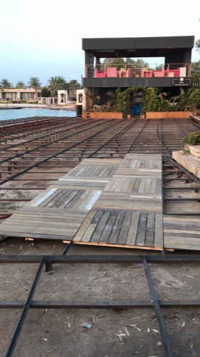 Creating and installing new beach club deck. Repurposed old decking to create new, durable design of deck tiles. Ugur Bolat designed, project managed and oversaw team to install entire deck