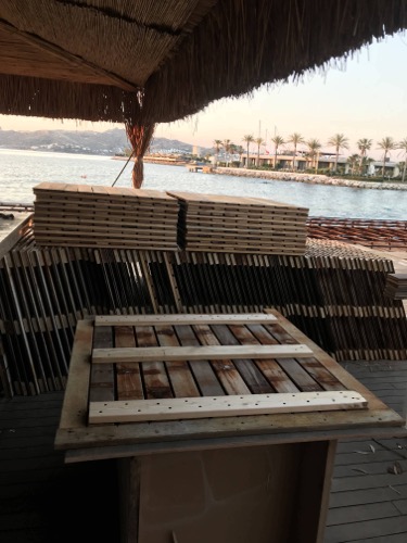 Creating and installing new beach club deck. Repurposed old decking to create new, durable design of deck tiles. Ugur Bolat designed, project managed and oversaw team to install entire deck